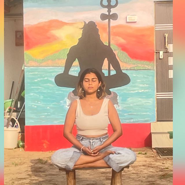 Kirti, founder of Back To Breathe, sitting peacefully in meditation